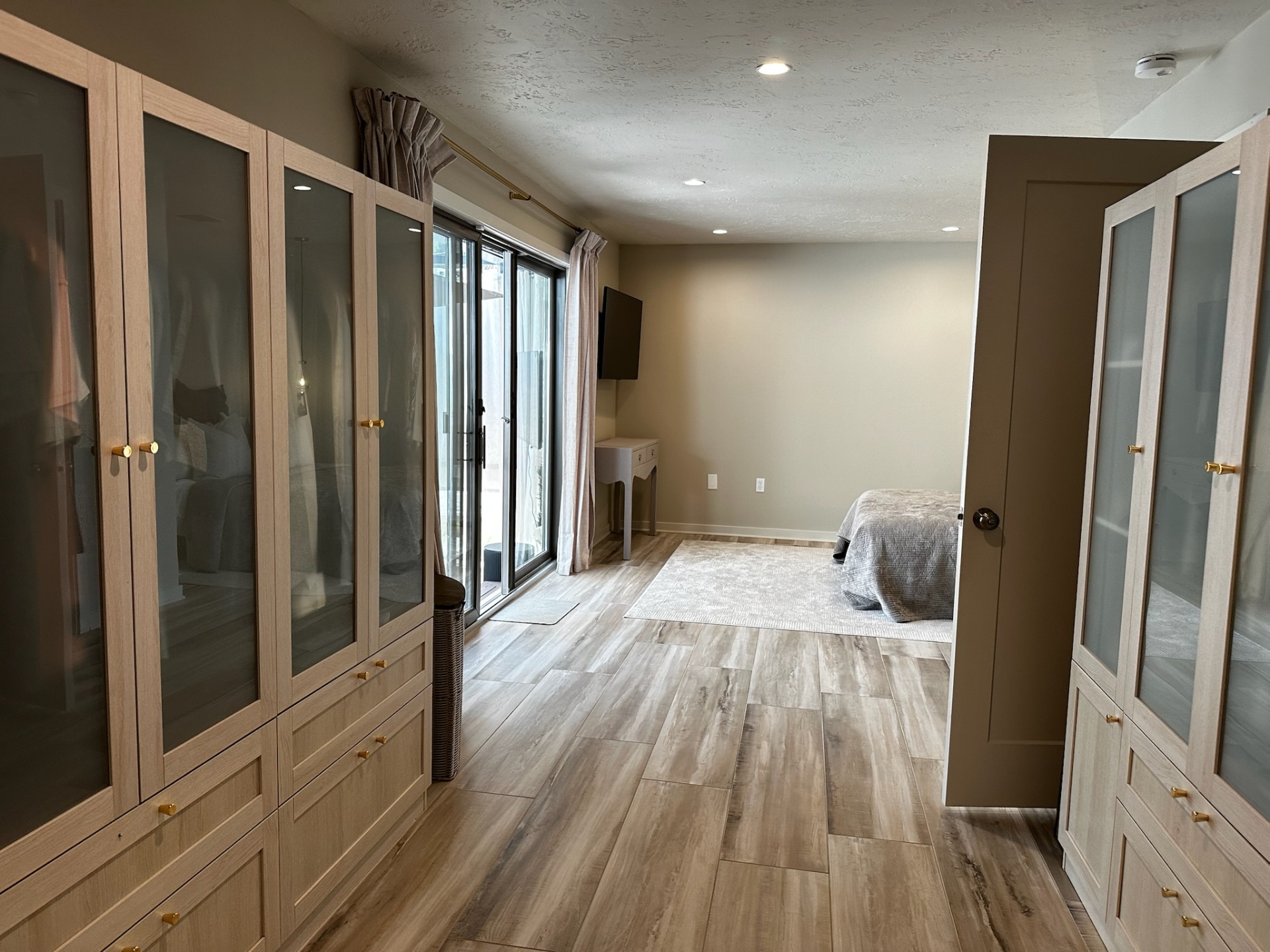 Built-in wardrobes open showing hanging space and drawers