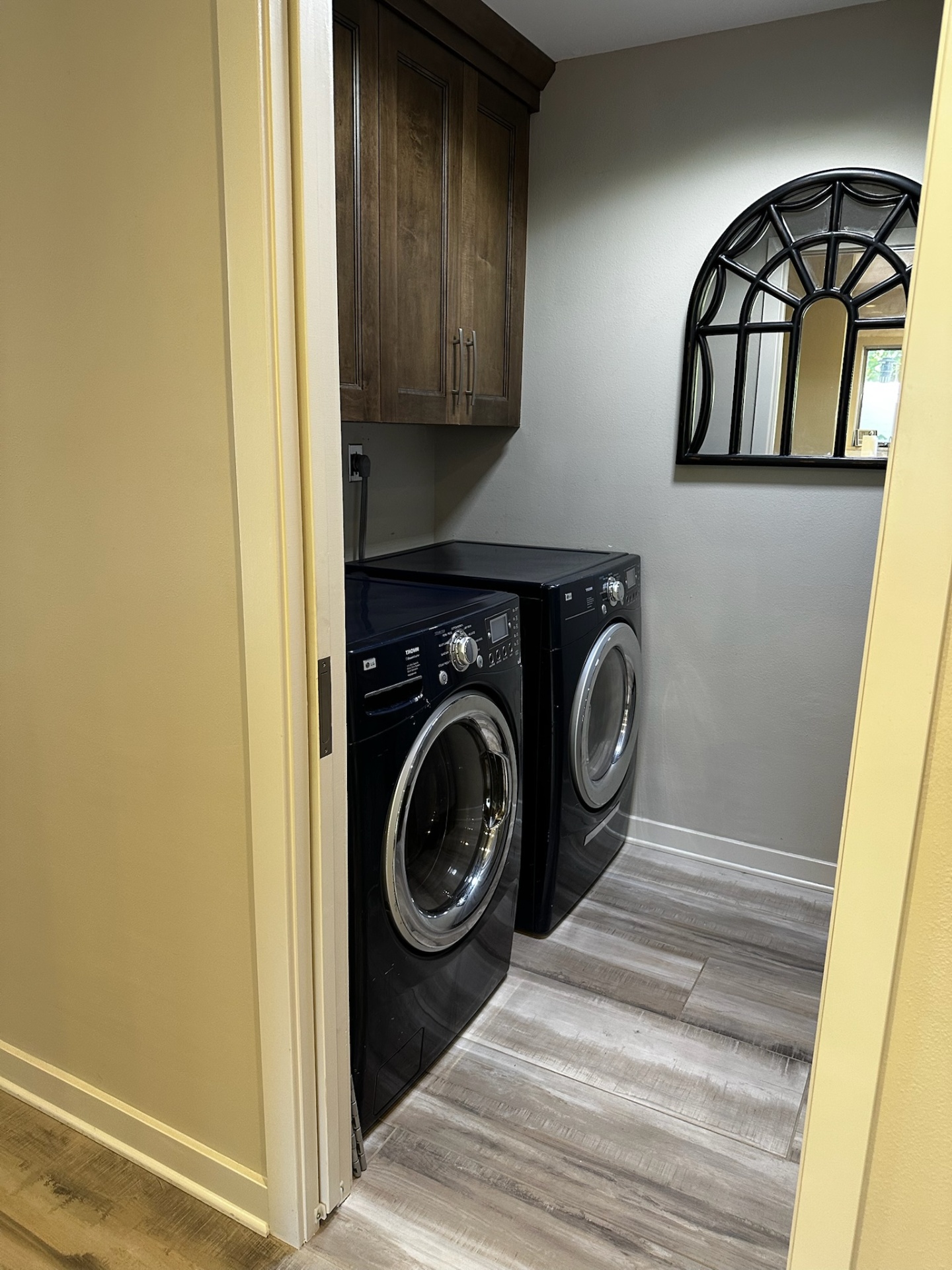 In-unit laundry closet with front-load washer and dryer