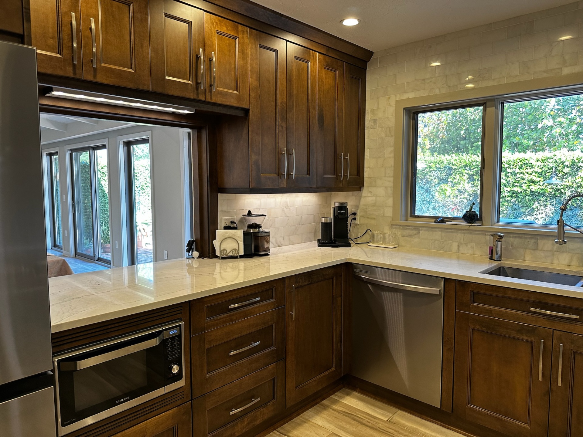 Kitchen nook with marble backsplash and garden window